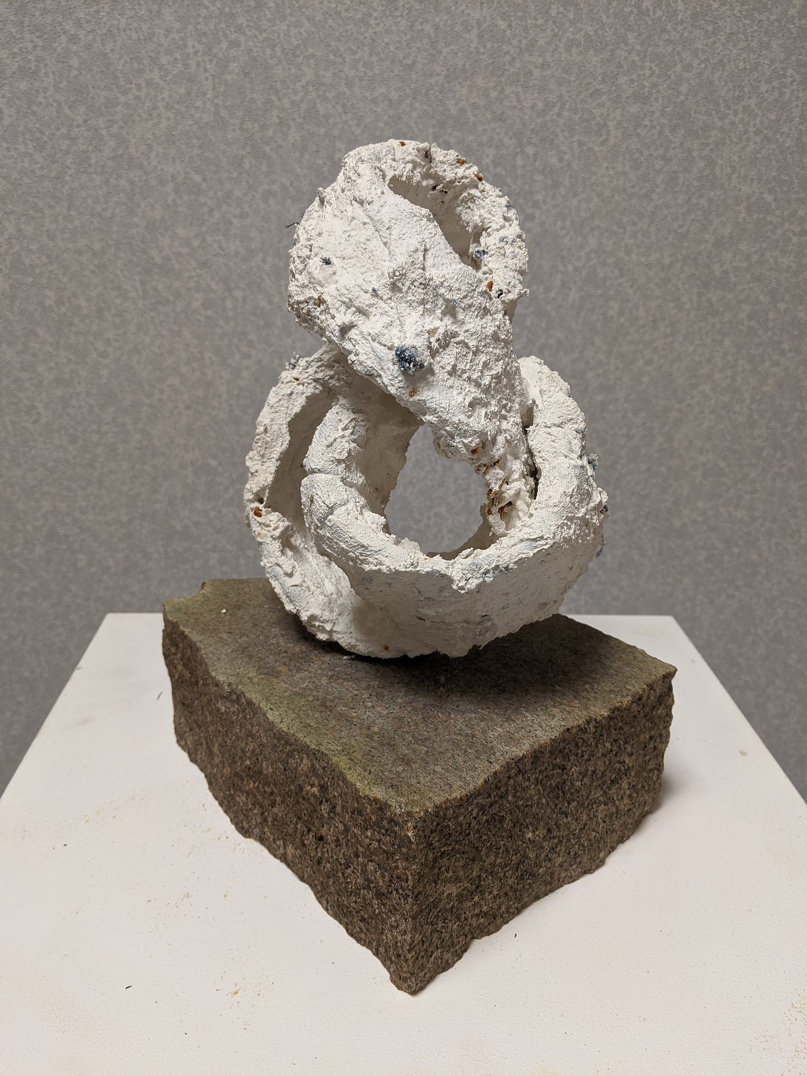 LOOP (MAQUETTE) - plaster and shredded denim jeans salvaged from Swedish cotton-recycling start up Renewcell, mounted on. marble fragment of tombstone salvaged from Robertons monumental carver in Aberdeen