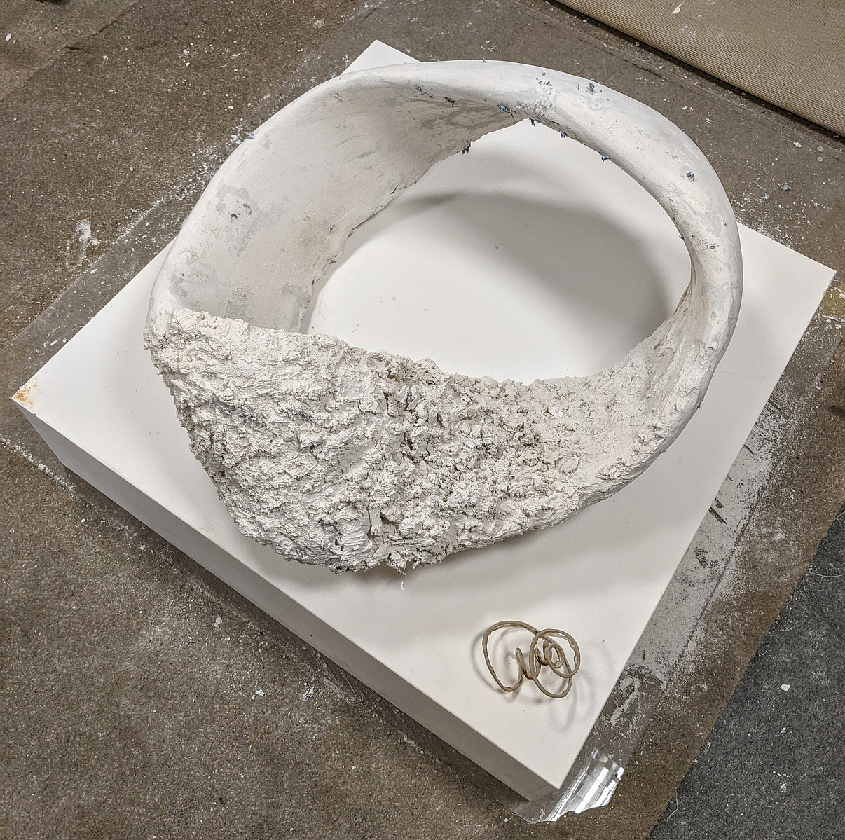 STANDING WAVE:- plaster, salvaged blue jeans & carborundum grit which contains fragmented ‘ghost image’ of the artists self portrait bonded to Bavarian limestone that was salvaged from lithographic process
