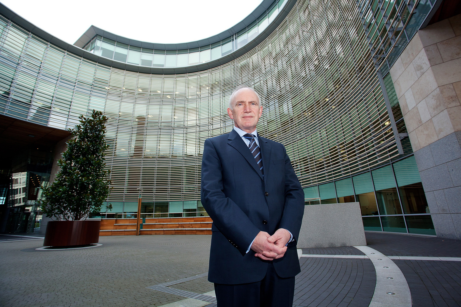 Corporate Photography full length business portrait of company director outside offices