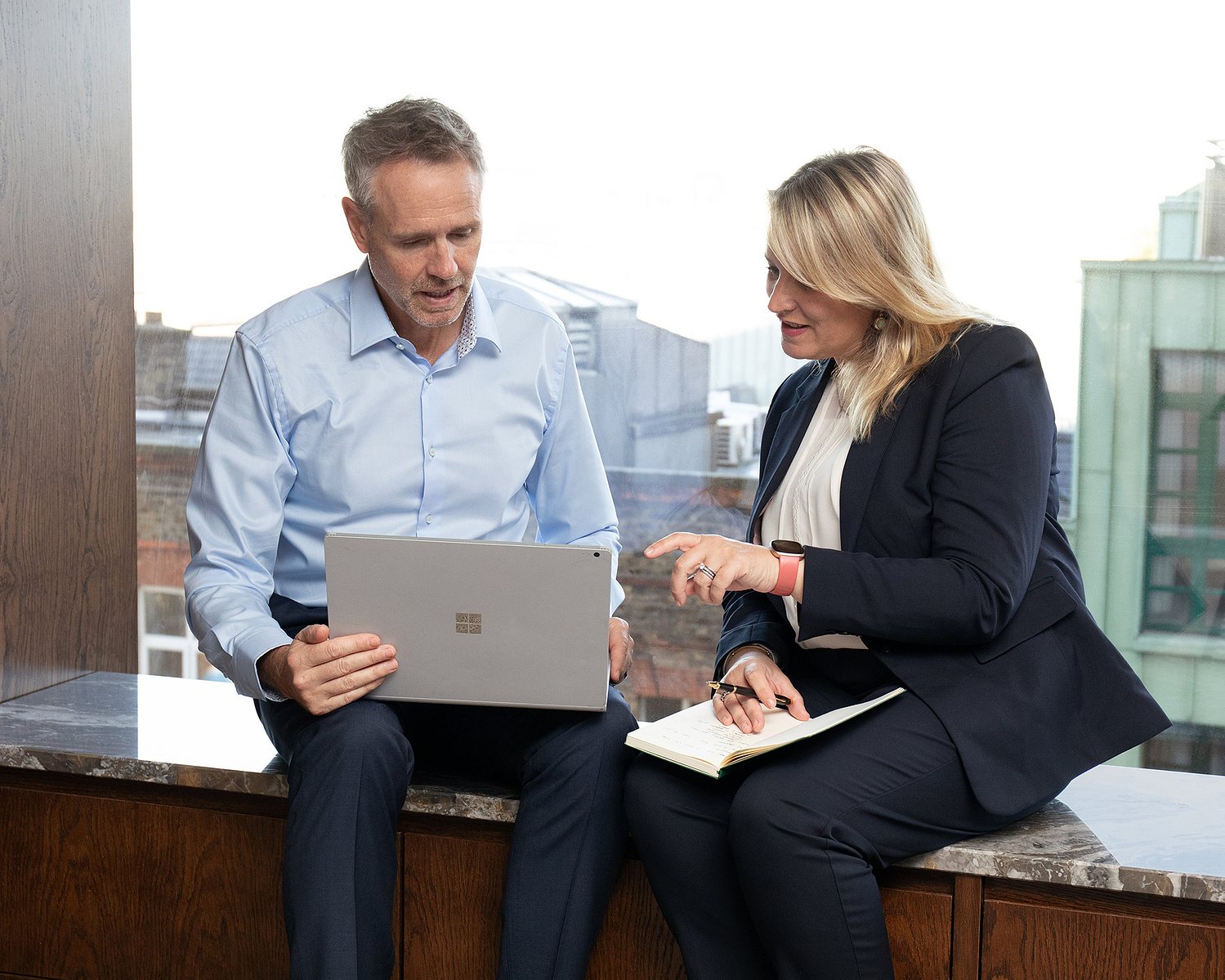 Lifestyle Business portraits for company website. Male professional working on laptop engaging with corporate client. Corporate Headshot & Business Portrait Photographer, Dublin
