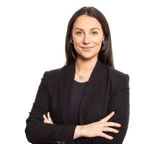Professional business Headshot of  young female in black suit white background