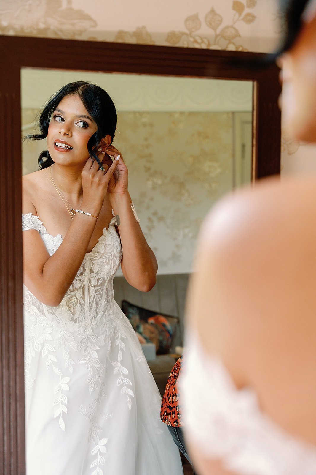 Guildford Manor Hotel & Spa Wedding Bride Putting On Earrings