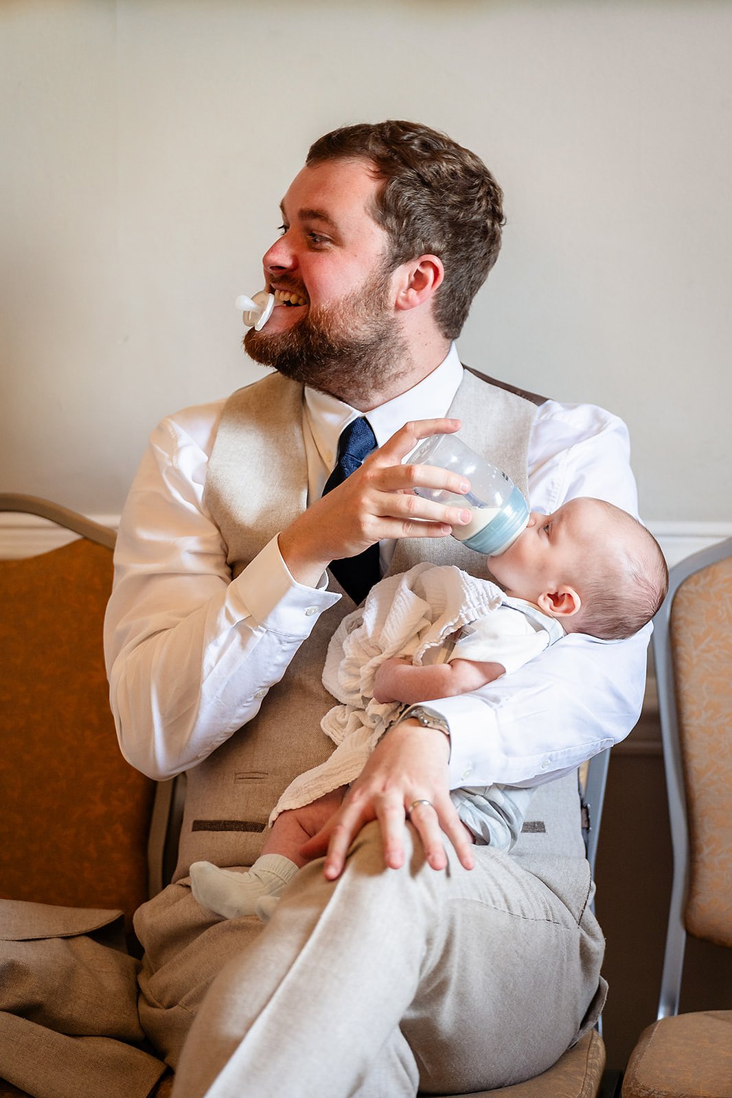 York House Wedding London Dad Feeding Baby