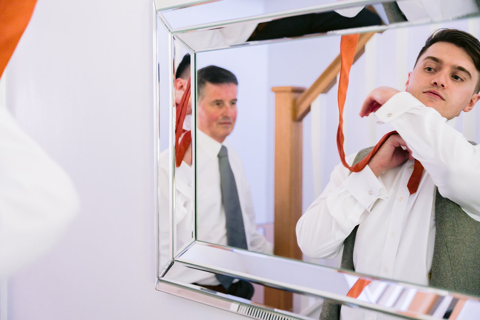 Guildford Manor Hotel & Spa Wedding Groom Putting On Tie