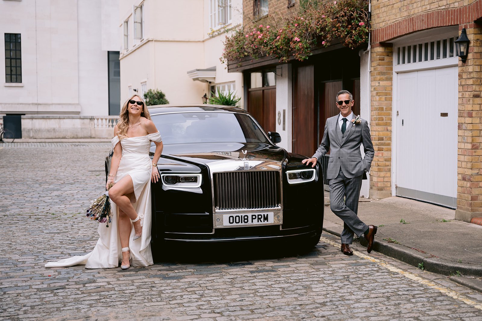 The Old Marylebone Town Hall Wedding Ruth Buscombe and Nathan Divey Posing Next To Rolls Royce Phantom