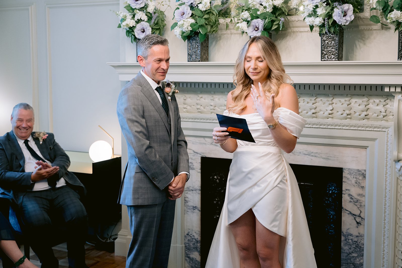 The Old Marylebone Town Hall Wedding Ruth Buscombe and Nathan Divey Exchanging Vows in Pimlico Room