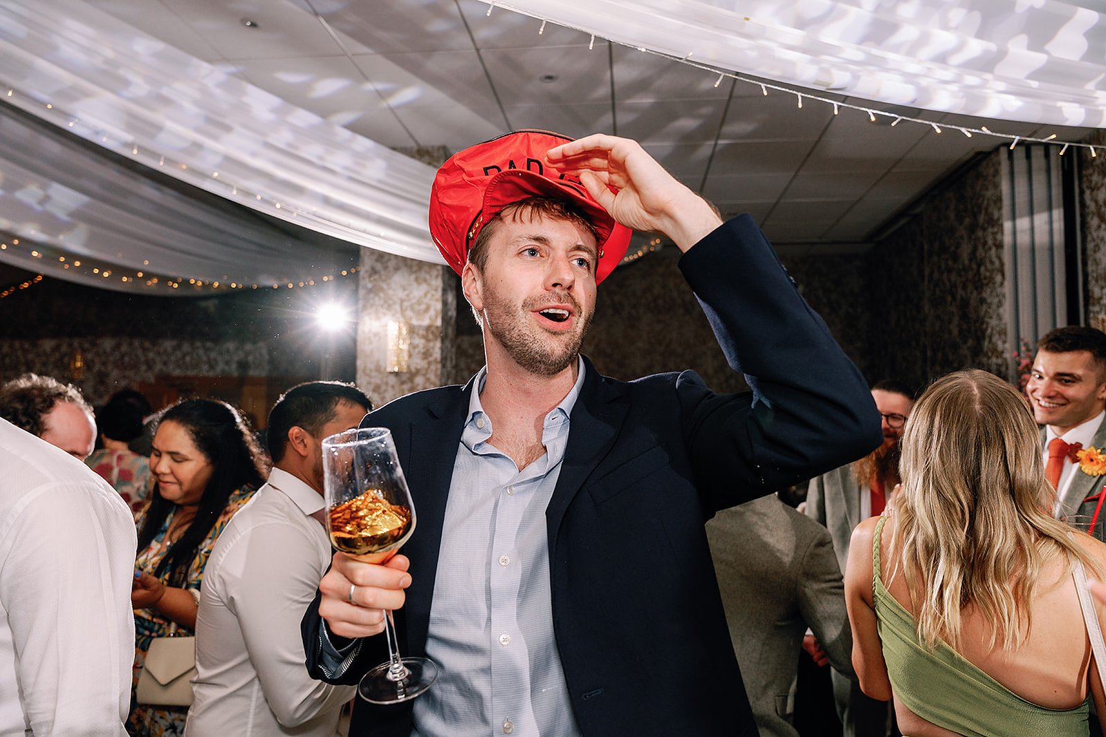 Guildford Manor Hotel & Spa Wedding Party Guest with Hat and Drink