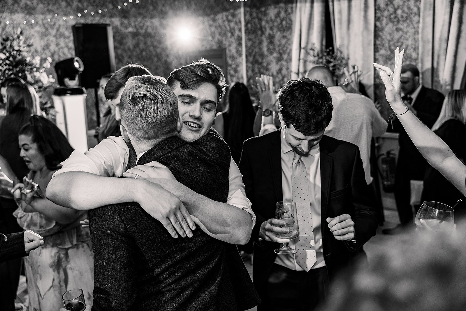 Guildford Manor Hotel & Spa Wedding Groom Hugging Guest