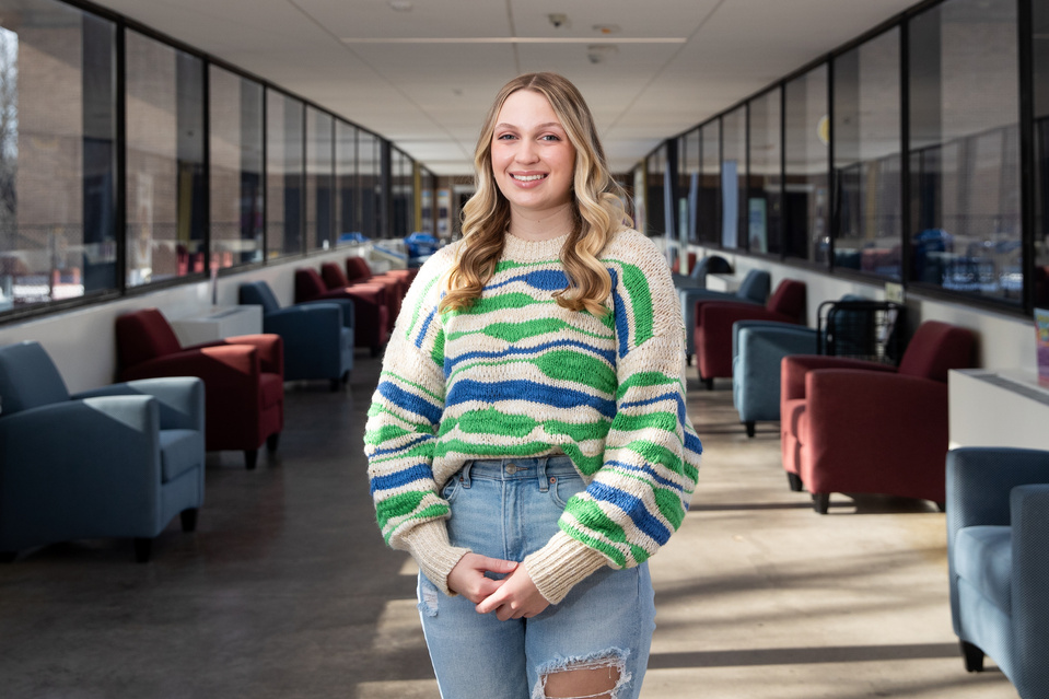 Ella Scrutchfield, a 21-year-old student at Black Hawk College, stands for a portrait, Monday, Jan. 9, 2023, in Moline.