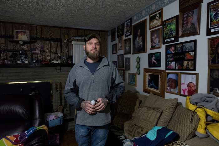 Kalen Patterson is a 29-year-old Afghanistan veteran from Ray, Ohio. He spends his free time racing his ATV, building his new house and spending time with his pets. Kalen posing at his mother’s house, November 11, 2018