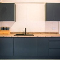 Ultra Sharp Studios mezzanine blue kitchen