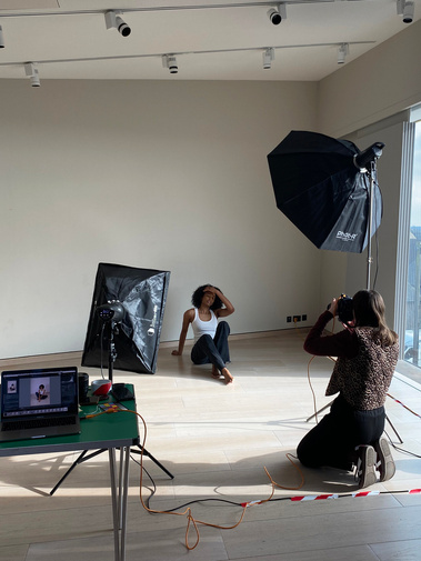 Behind the scenes photo of Sophie Ellen Photography, by Hannah Gadd, photographing a model in the studio.