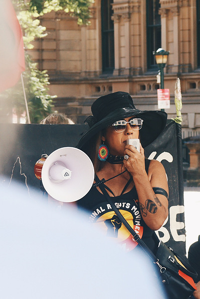 Senator Lidia Thorpe with a megaphone outside Sydney Town Hall