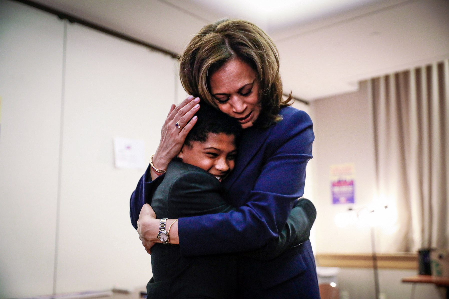 Senator Kamala Harris embraces her godson Alexander Hudlin, 11 (left) ahead of her presidential campaign rally in of Oakland, Calif., on Sunday, Jan. 27, 2019.
