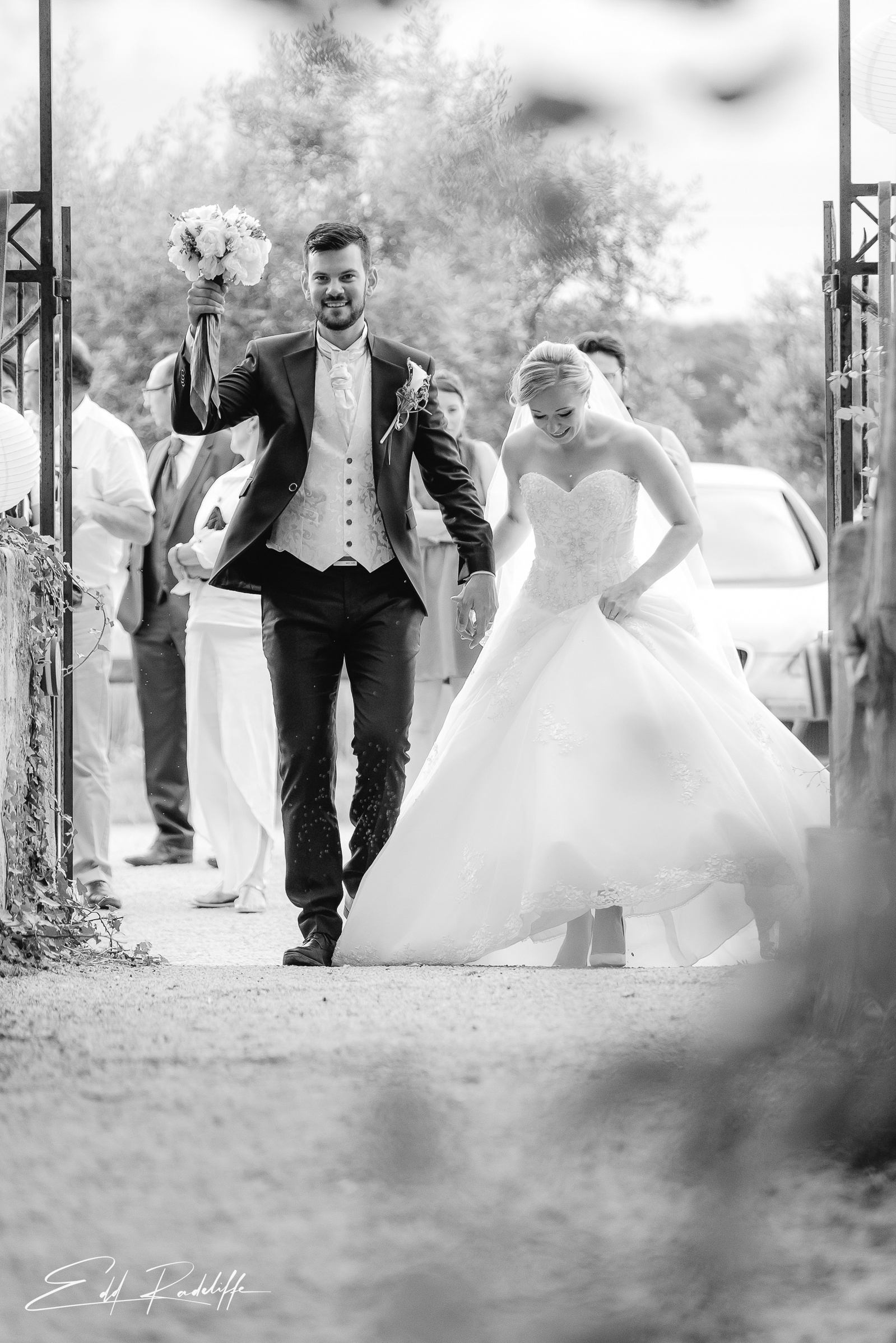 Bride and Groom walk back down the aisle after getting married at Garons, France for Edd Radcliffe Photography - documentary style wedding photography