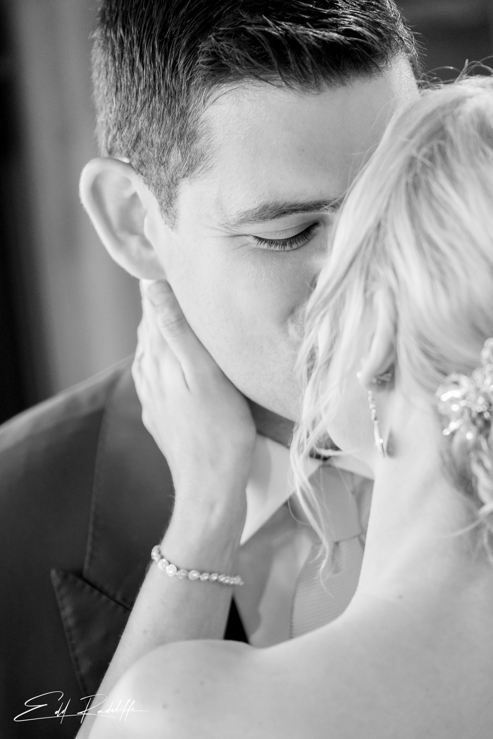 Bride and Groom share a kiss at Porthmawr Country House in Crickhowell, Wales for Edd Radcliffe Photography - documentary style wedding photography