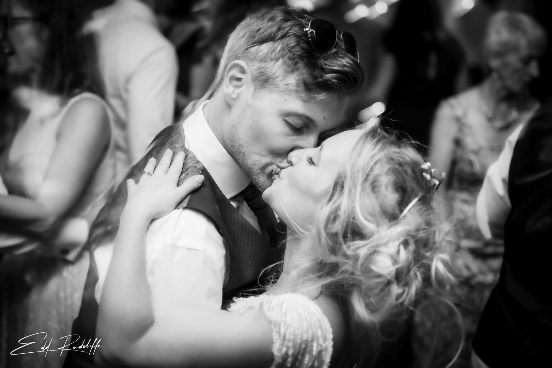 Groom kisses Bride as they dance at wedding reception at Groomes in Hampshire for Edd Radcliffe Photography - documentary style wedding photography