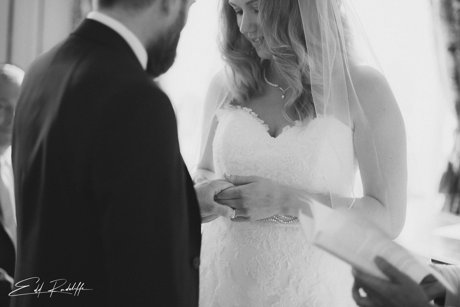 Close up on Bride and Groom holding hands during wedding ceremony at Hôtel de Cours de Thomazeau in Castilliones for Edd Radcliffe Photography - documentary style wedding photography