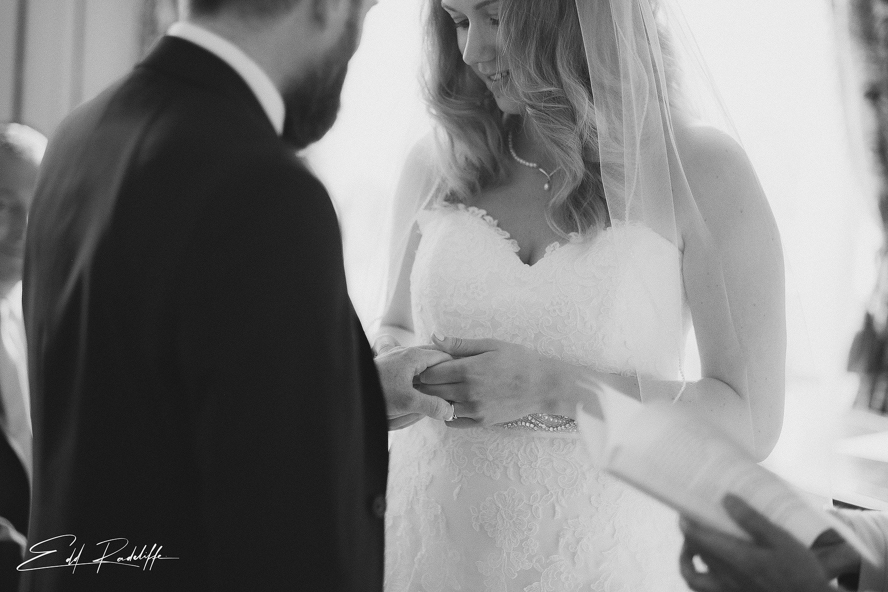 Close up on Bride and Groom holding hands during wedding ceremony at Hôtel de Cours de Thomazeau in Castilliones for Edd Radcliffe Photography - documentary style wedding photography