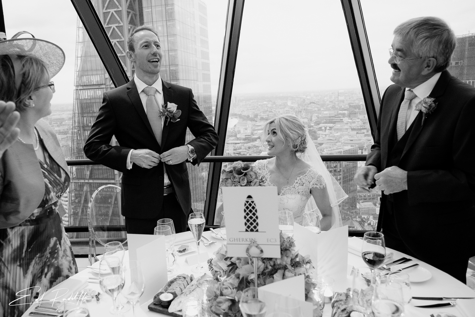 Groom giving wedding speech at The Gherkin with view of Shard behind from Edd Radcliffe Photography - documentary style wedding photography