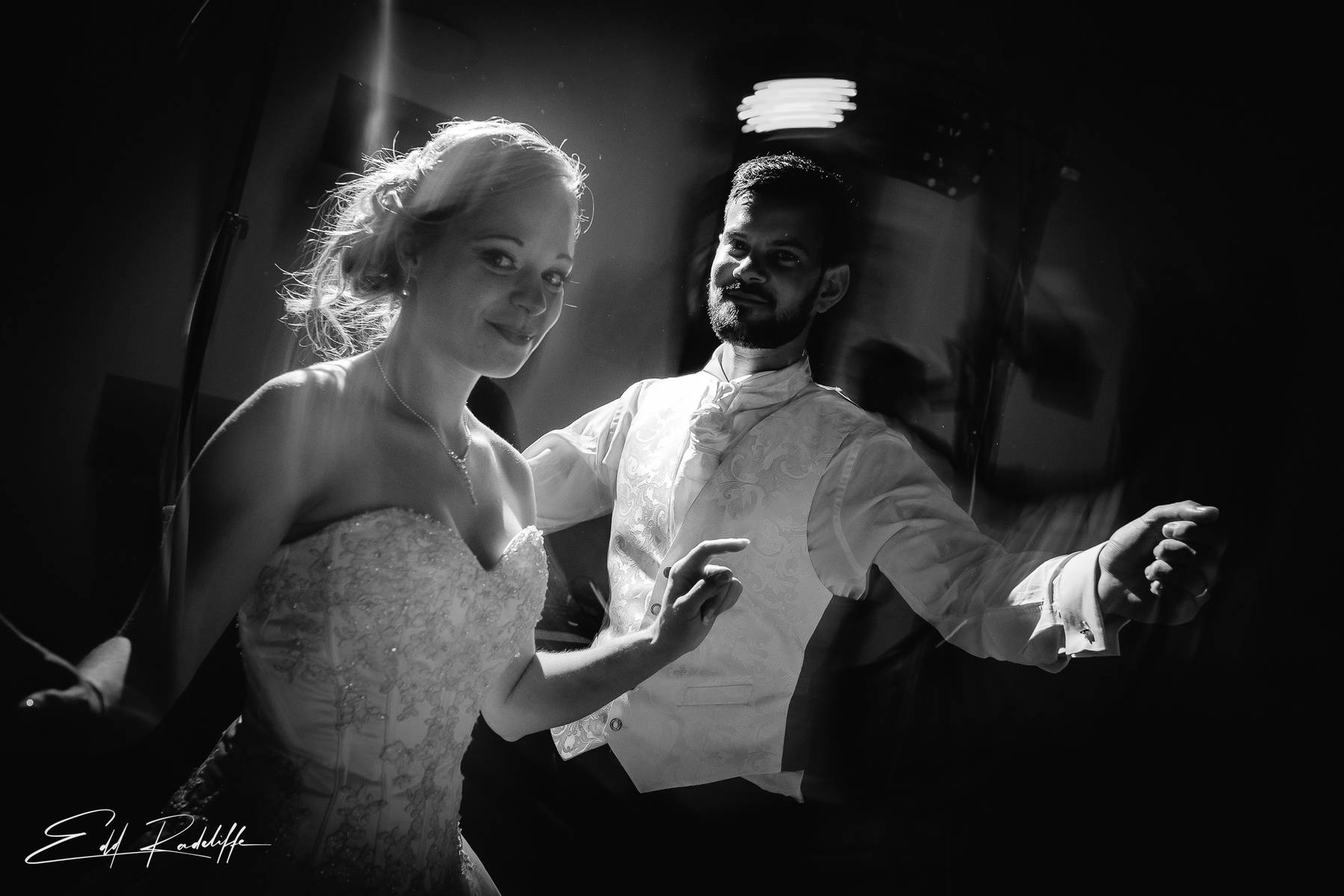 Bride and Groom twirl on dance floor at their wedding reception at Garons, France for Edd Radcliffe Photography - documentary style wedding photography