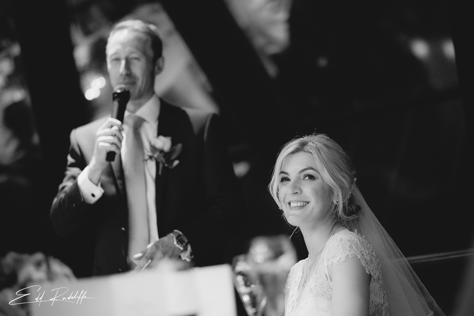 Groom giving wedding speech next to smiling Bride at Searcys, 30 St Mary's Axe, London from Edd Radcliffe Photography - documentary style wedding photography
