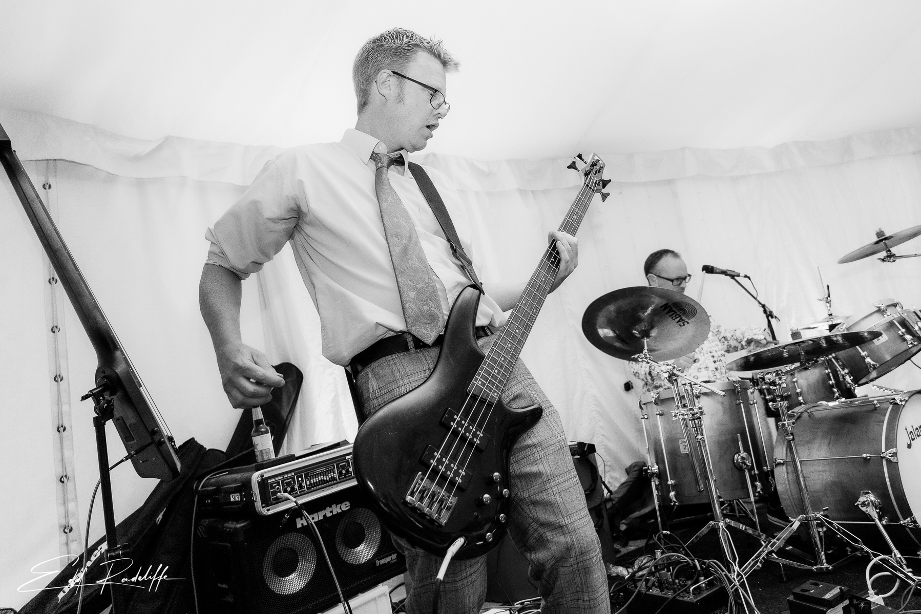 Man on stage with guitar at Groomes in Hampshire for Edd Radcliffe Photography - documentary style wedding photography