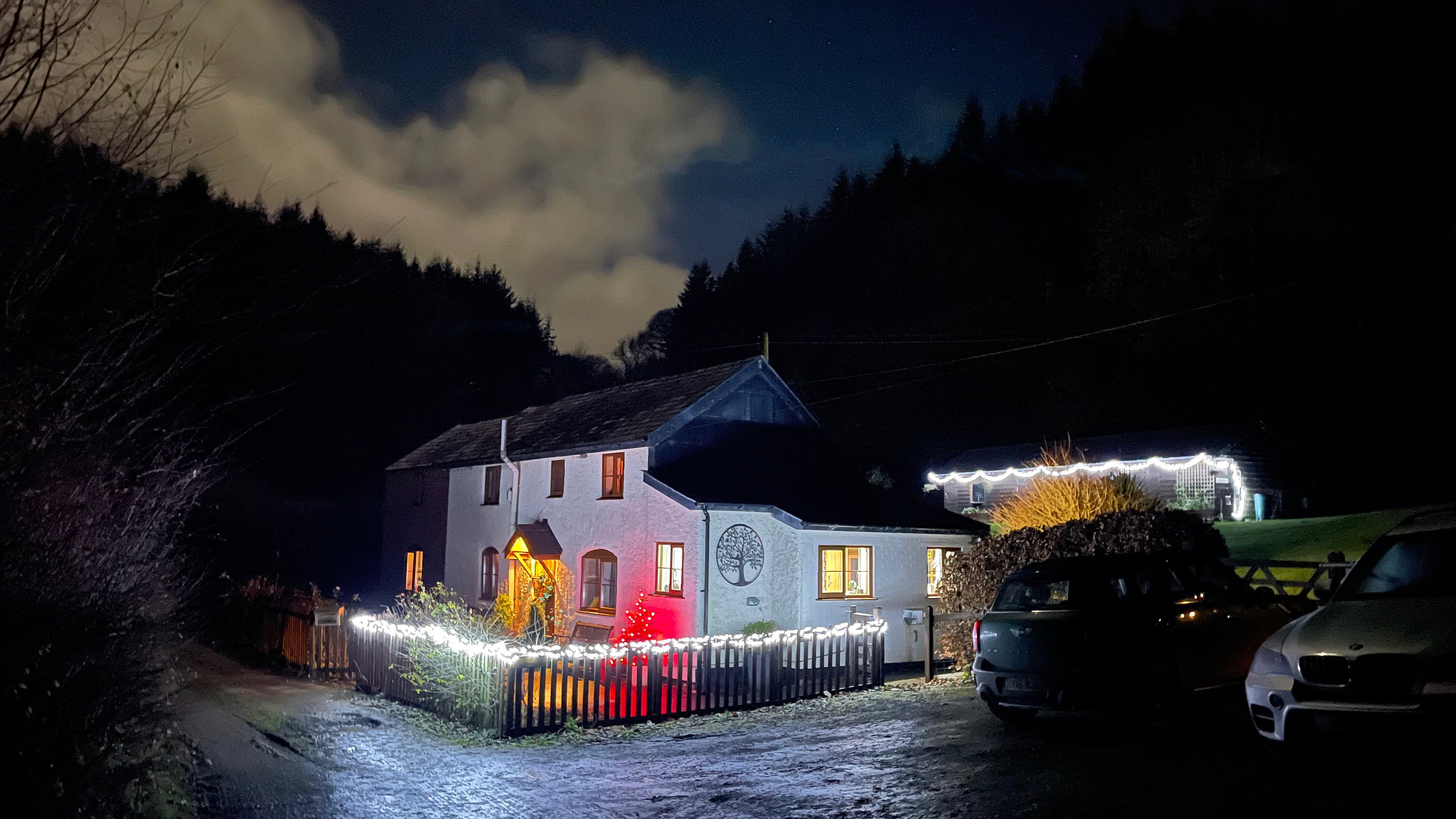 SHUTTASPEED NIGHT SHOT OF CHRISTMAS LIGHTS ON A COTTAGE