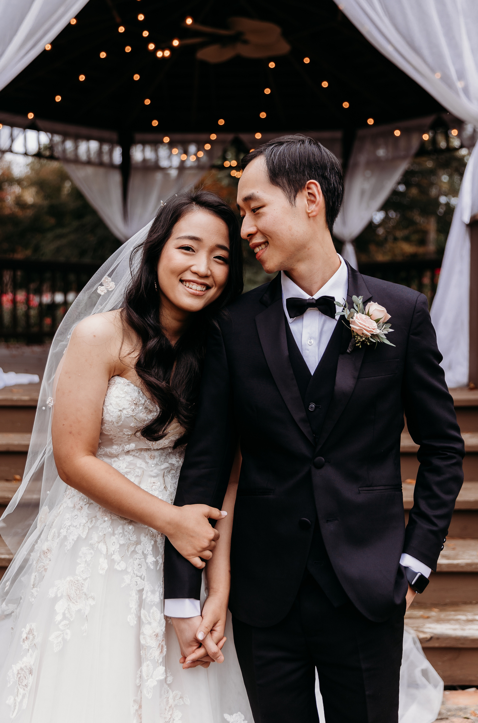 bride snuggles up to grooms shoulder