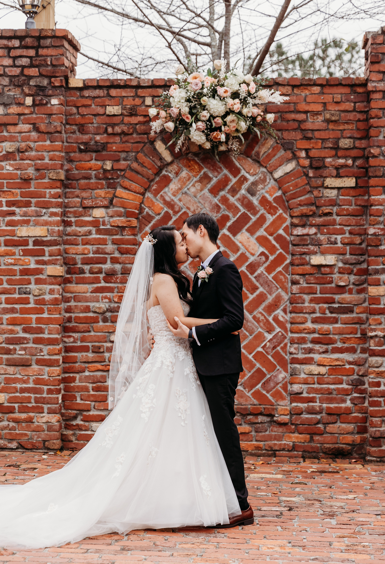 bride and groom share a first kiss at the conclusion of their ceremony