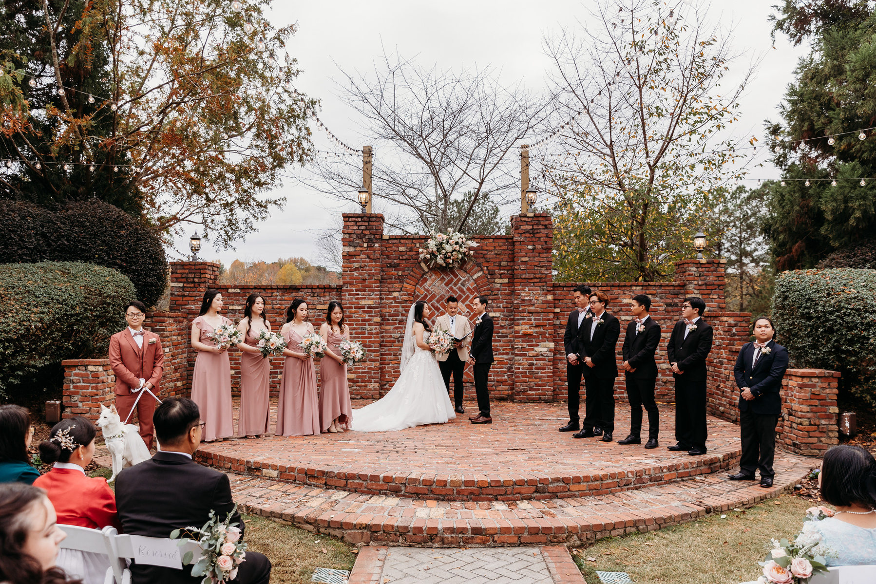 bride, groom, and wedding party during the wedding ceremony