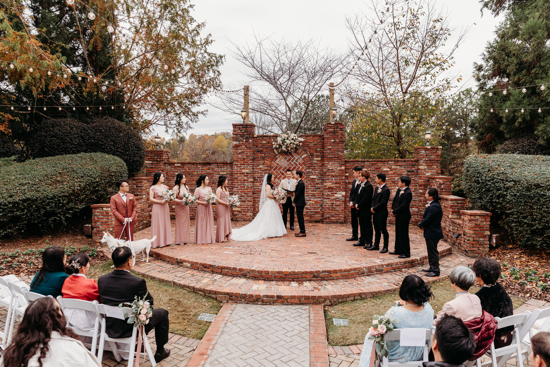bride, groom, and wedding party during the wedding ceremony