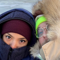 very cold selfie with frozen lake in the background