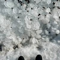 view of shoes, looking down at icy terrain