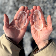 hands holding ice forms made from rock molds