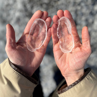 hands holding ice forms made from rock molds