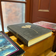 ginko leaf pressed on book at the bookstore