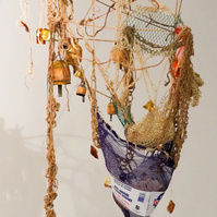 Hornest. Tactile and sensory piece with bells for sound.