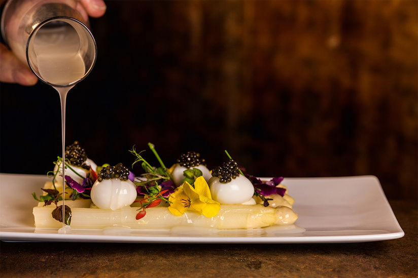 Fresh flower and asparagus dish at Michelin star restaurant Parkheuvel, Rotterdam, Netherlands.