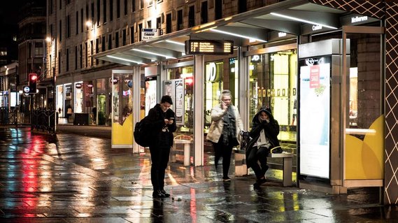 People standing at bus station