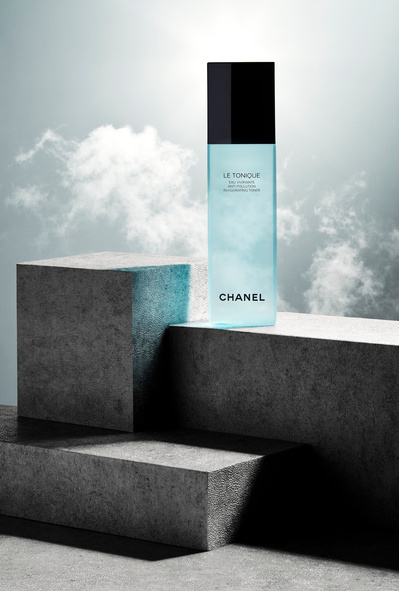 A compelling composition featuring three large bricks arranged, with one of them elegantly showcasing a cosmetic product. This visually engaging image is skillfully photographed by David Lineton, an expert in London cosmetics photography. 