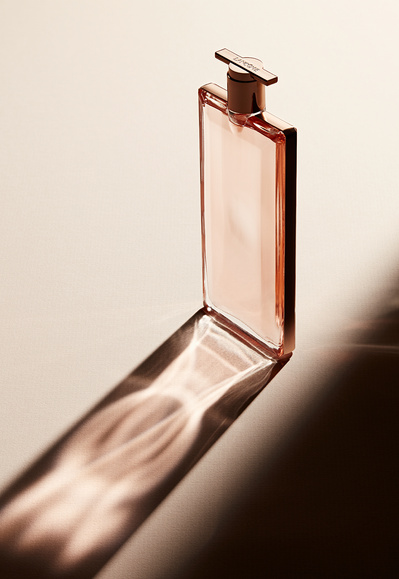 A captivating image capturing the beauty product bottle in exquisite detail, accompanied by its graceful shadow elegantly cast on the ground. Skillfully photographed by David Lineton, an expert in London still-life photographer