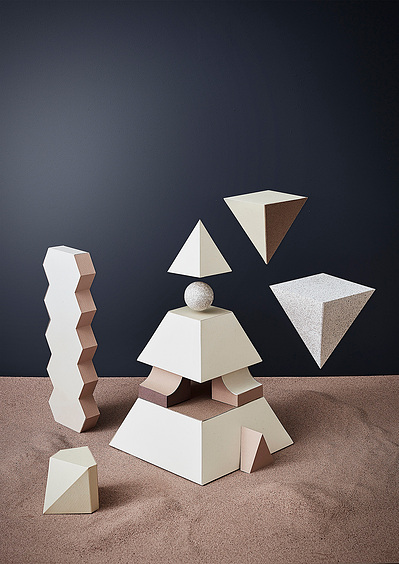 A captivating composition featuring the white structure of a broken pillar, rollers. This visually intriguing still life photograph is expertly crafted by David Lineton, a specialist in still life photography studio in London