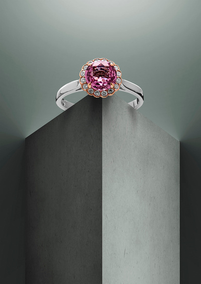 The stunning ring with a white band, featuring a big purple pearl and small white pearls around it.This visually dynamic arrangement is skillfully captured by David Lineton, an expert in luxury product photography in London