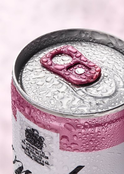 A captivating top-down photograph capturing a drink can adorned with water drops, creating a refreshing and dynamic composition. This visually appealing image is skillfully captured by David Lineton, an expert drinks advertising photographer in London.