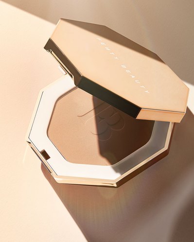 A captivating composition featuring a half-open makeup product delicately placed on a surface with the same color, creating a harmonious and aesthetically pleasing scene. This visually engaging image is skillfully photographed by David Lineton, an expert 