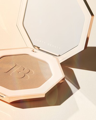 A captivating image capturing a half-opened beauty product delicately balanced on the ground. This aesthetically pleasing composition is skillfully photographed by David Lineton, an expert in London beauty makeup photography. 
