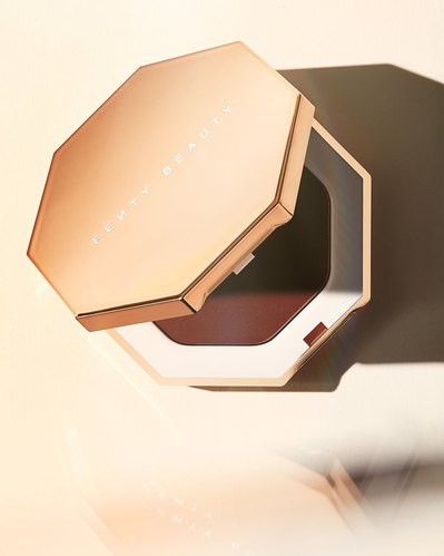 A visually enticing image capturing a beauty product, artfully presented with half of it open, photographed from a top-down perspective. This elegant composition is skillfully photographed by David Lineton, an expert in cosmetics photography. 