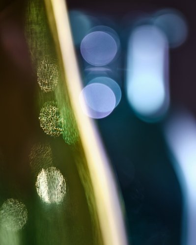 A detailed close-up view capturing round circles in the image, creating a scene resembling the view of almost closed eyes. This artistically composed image is expertly captured by David Lineton, a specialist in still life object photography in London.