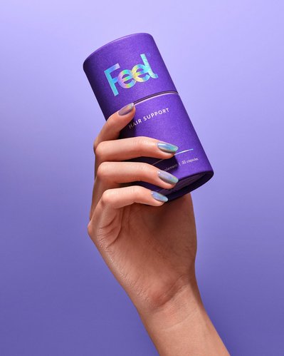 A compelling composition capturing the Hair Support product delicately held in the hand of a girl, with her nail polish complementing the color of the shampoo. This still-life imagery is thoughtfully arranged and skillfully photographed by David Lineton.
